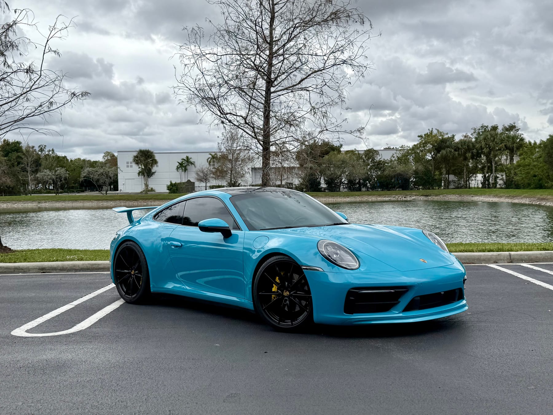 Miami Blue Porsche 911 Carrera S (992) photographed lakeside by Velocity Factor in Coral Springs