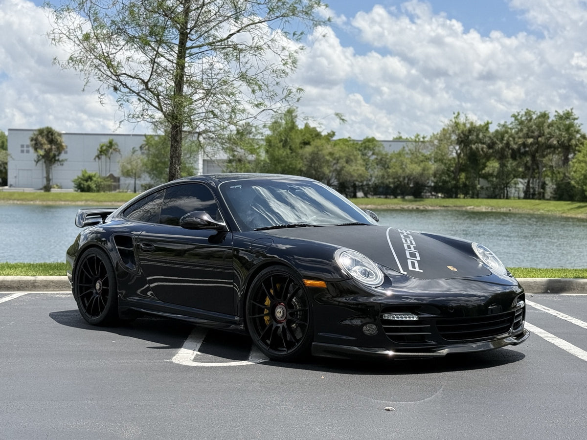 Black Porsche 997.2 Turbo S on Öhlins coilovers and Powerflex suspension at Velocity Factor