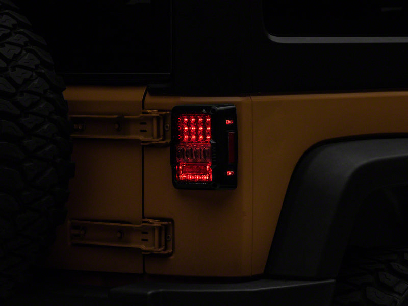 Raxiom 07-18 Jeep Wrangler JK Axial Series Lux LED Tail Lights- Black Housing (Clear Lens)