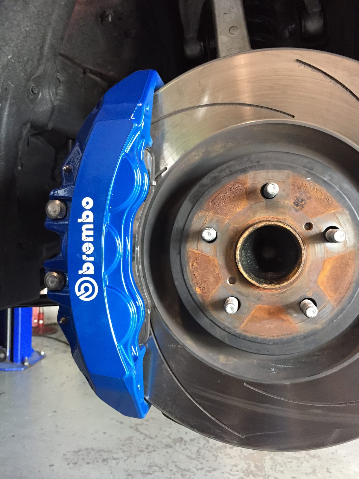 Brembo brake caliper refinished in gloss blue with fresh white lettering at Velocity Factor