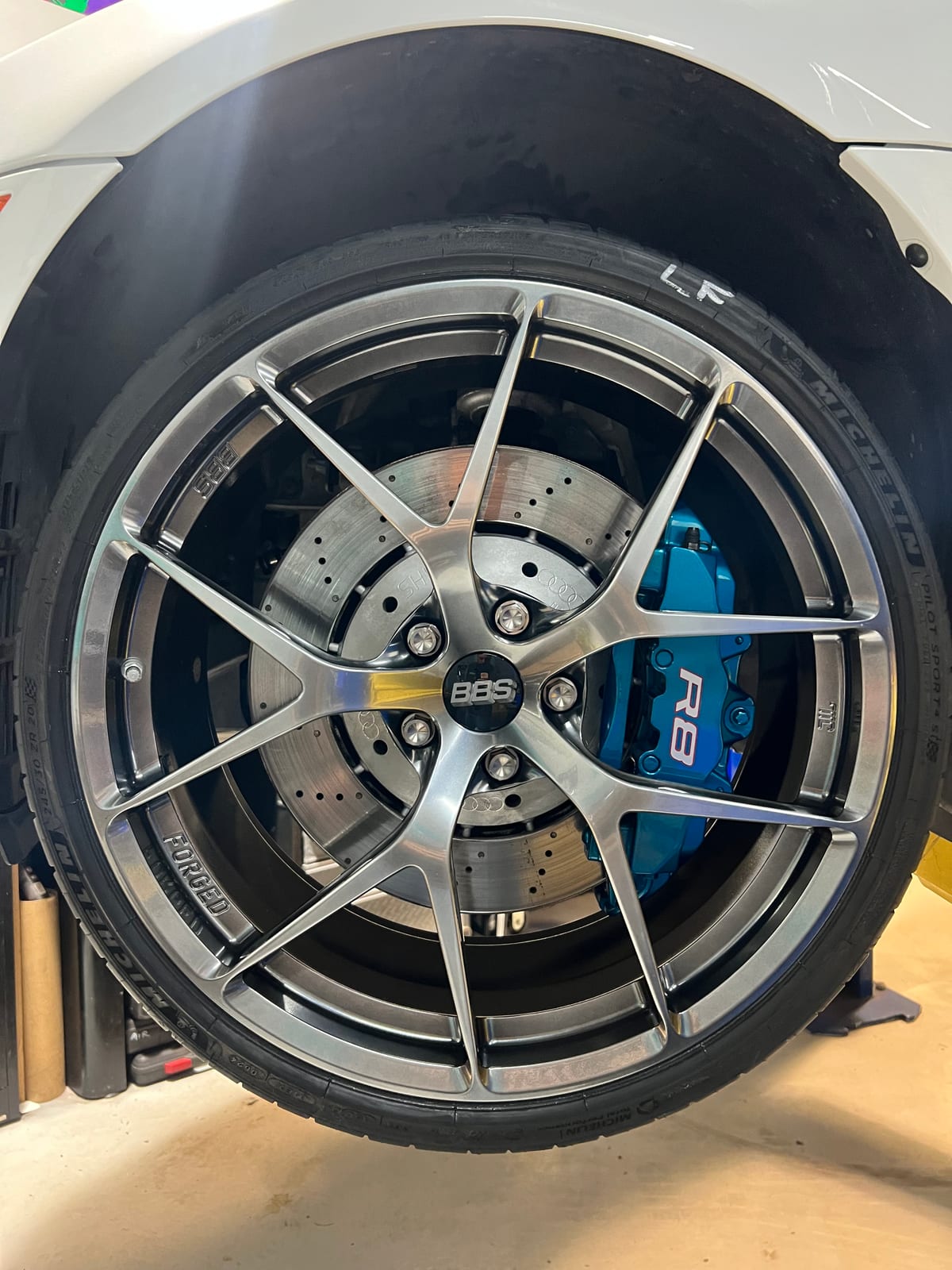 Audi R8 with teal refinished brake calipers and BBS forged wheels in the Velocity Factor shop