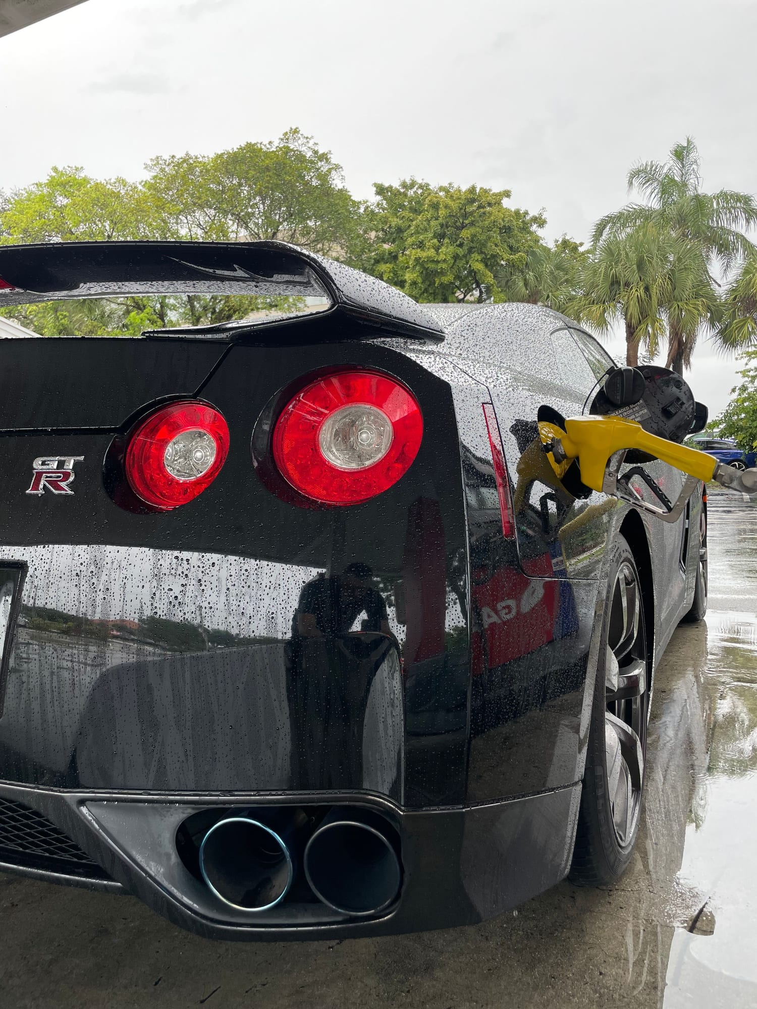 Rear of a black Nissan GT-R R35 at Velocity Factor after a wash