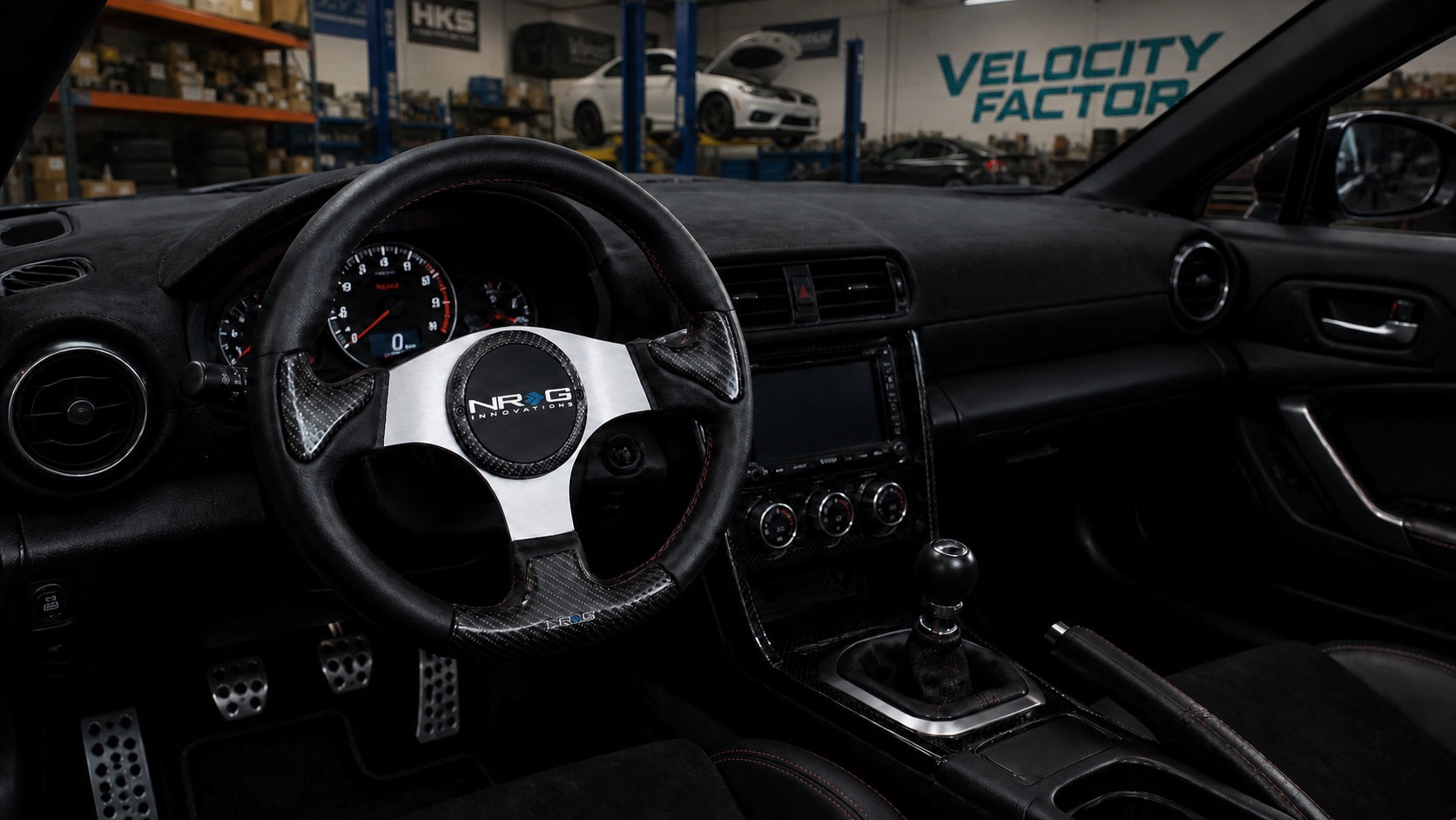 NRG performance steering wheel professionally installed in a left-hand-drive enthusiast car at Velocity Factor