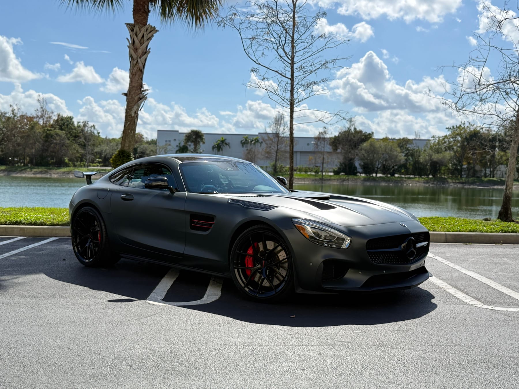 Black Mercedes-AMG GT photographed lakeside by Velocity Factor in Coral Springs
