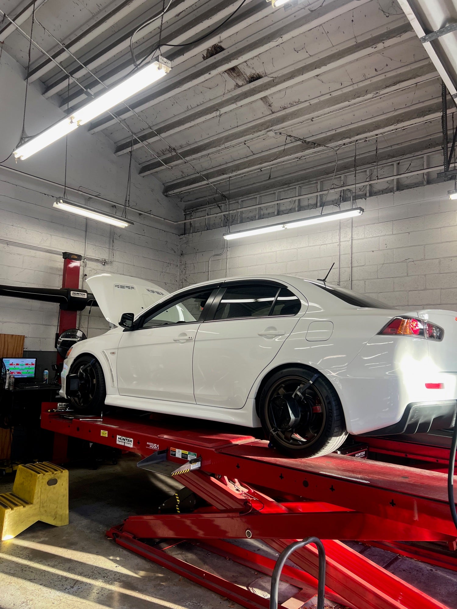 Mitsubishi Lancer Evolution on the Hunter alignment rack at Velocity Factor