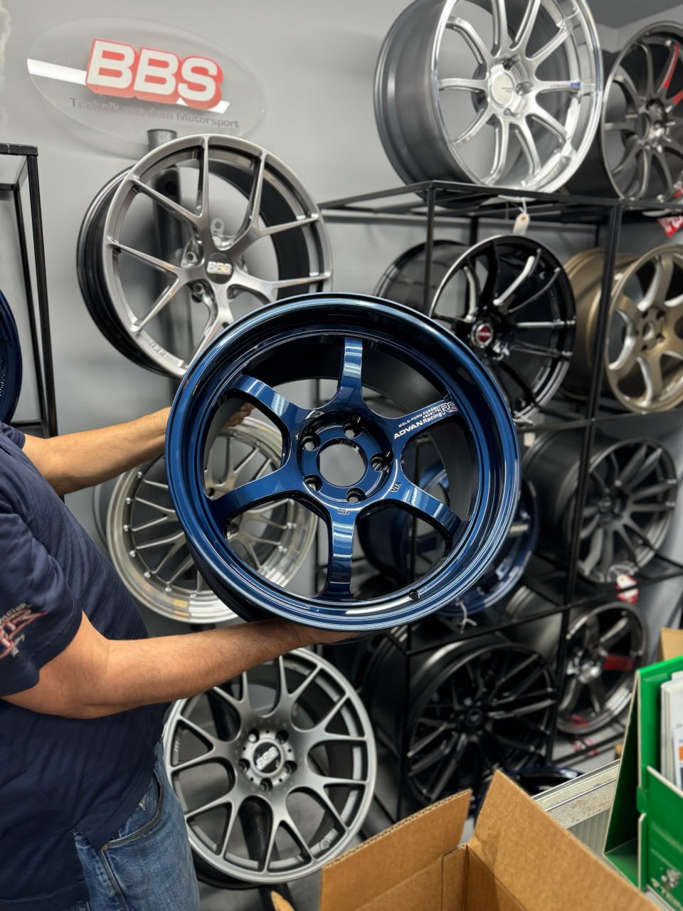 Racing blue Advan Racing R6 wheel on display in the Velocity Factor showroom